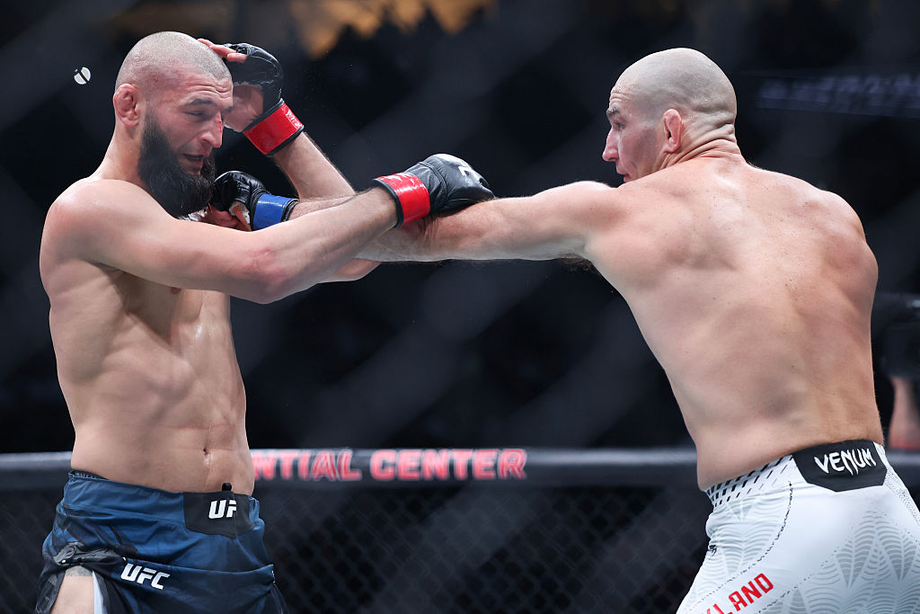 Then-middleweight champion Hamzat Chimaev (left, UAE) takes a punch from challenger Sean Strickland (United States) during the UFC 328 title fight at Prudential Center in Newark, New Jersey, in May. Strickland won by decision to claim the championship. [Getty Images]