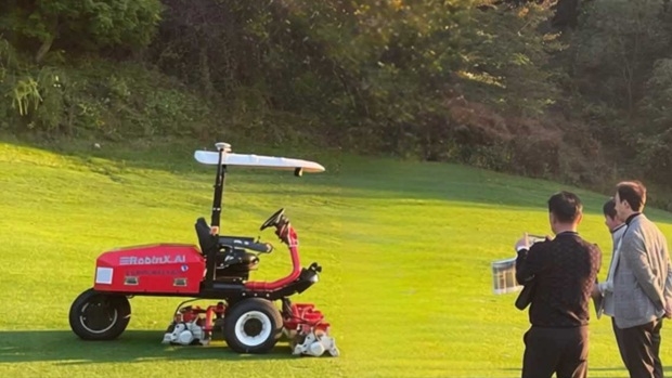 TXR Robotics demonstrates its "intelligent three-gang mowing robot" at Pureunso Country Club in Pocheon, Gyeonggi Province, on Thursday. [Company photo]