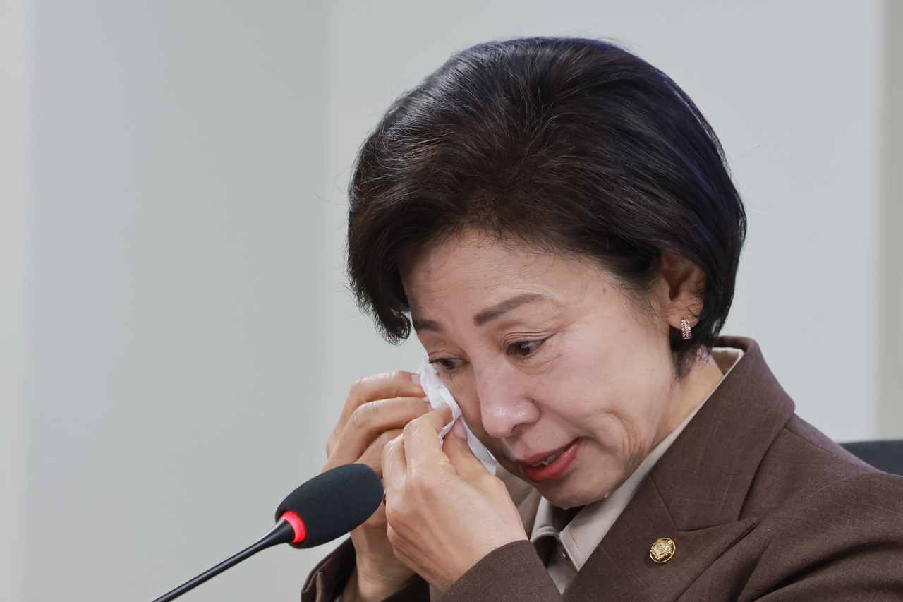 Democratic Party Rep. Nam In-soon sheds tears as she presided over a meeting on the party's special committee on the Itaewon crowd crush at the National Assembly on Friday. (Yonhap)