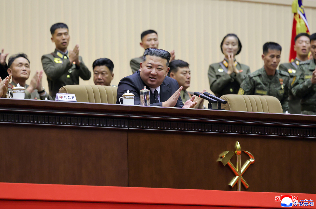 North Korean leader Kim Jong-un applauds with participants at the Third Company Commanders' Conference of the Korean People's Army, held in Pyongyang on Thursday and Friday. [Yonhap]