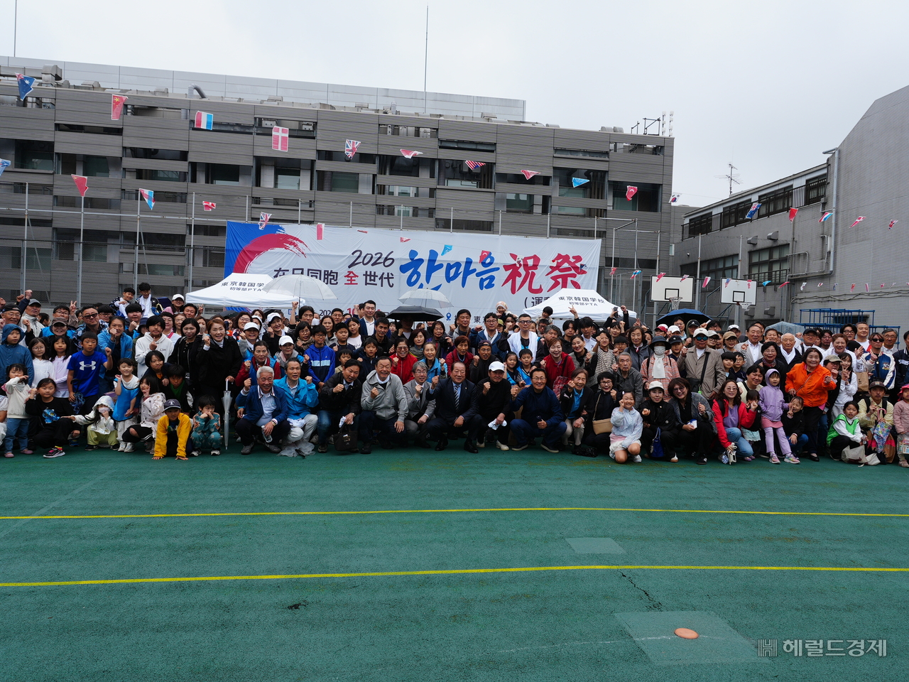 Participants take a group photo after the event