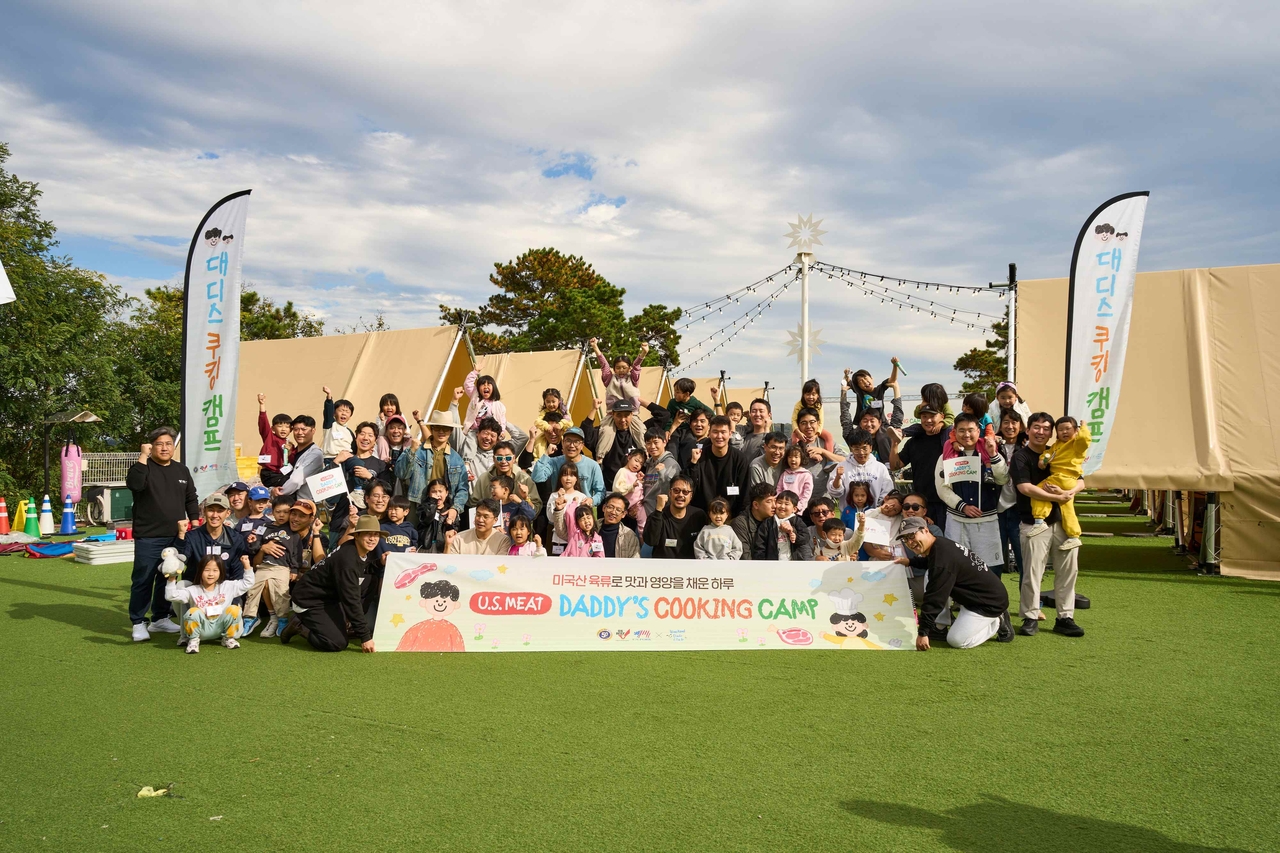 Participants pose for a group photo at the US Meat Daddies Cooking Camp. [Provided by the US Meat Export Federation]