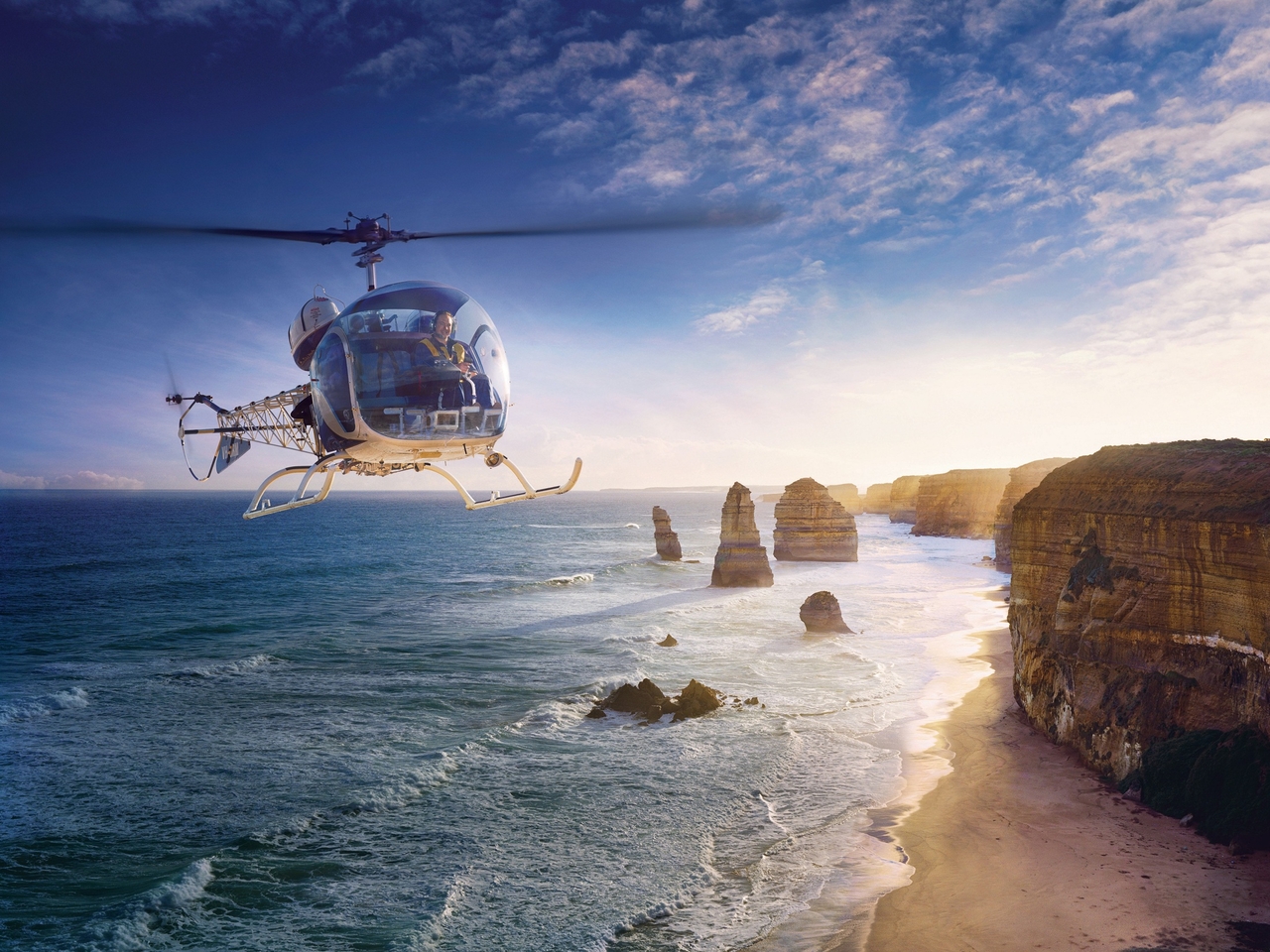 A helicopter tour over the Great Ocean Road in Australia [Courtesy of Tourism Australia]