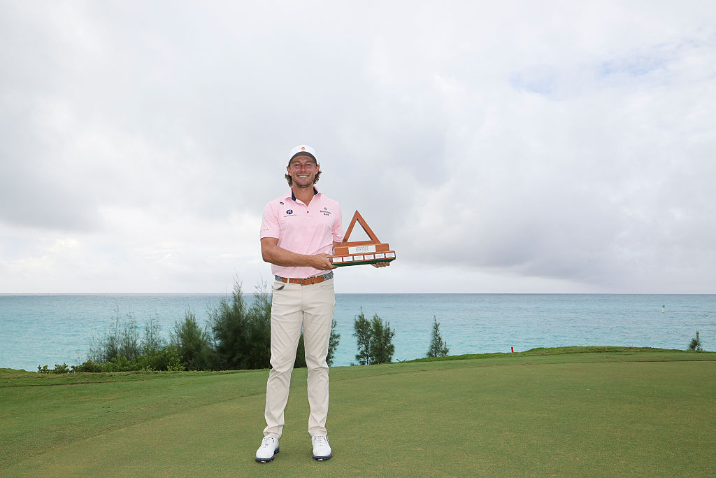 Austin Smotherman of the United States celebrates with the trophy after winning the PGA Tour Butterfield Bermuda Championship at Port Royal Golf Course in Southampton, Bermuda, on Monday (Korean Standard Time). Smotherman defeated Seamus Power of Ireland in a three-hole playoff after strong winds forced the cancellation of the final round, claiming his second PGA Tour title. [Getty Images]