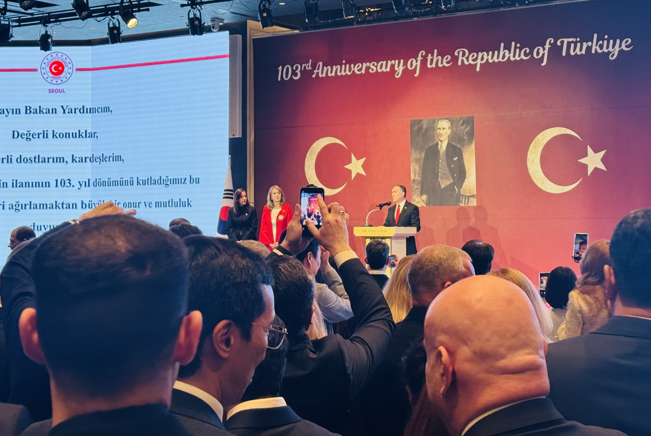 Turkish Ambassador to South Korea Fatih Yildiz speaks before a portrait of the republic’s founder, Mustafa Kemal Ataturk, at a reception marking the 103rd anniversary of the proclamation of the Republic of Turkey in Seoul on Monday. (Sanjay Kumar/The Korea Herald)
