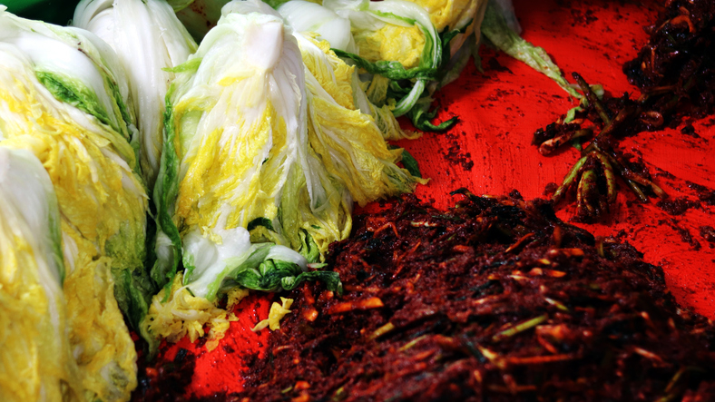 Cabbage and radishes are prepared for kimchi-making.