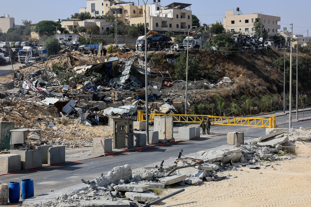 Debris lie at the site of a shooting on Friday, after Israeli forces demolished Palestinian businesses in Hebron, in the Israeli-occupied West Bank, Saturday. (Reuters-Yonhap)