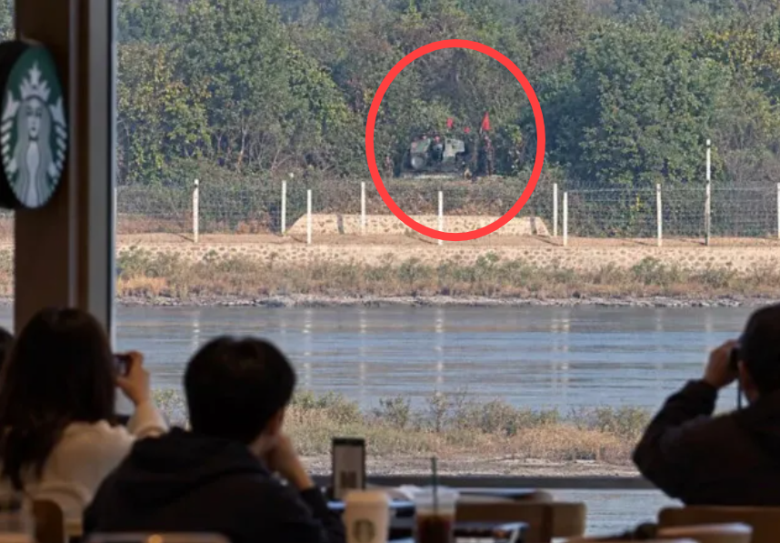 A manipulated image showing North Korean self-propelled artillery and soldiers stationed near the coast of Kaepung County, North Korea, purports to be taken from a Starbucks store at the Aegibong observatory in Gimpo, Gyeonggi Province. (X)