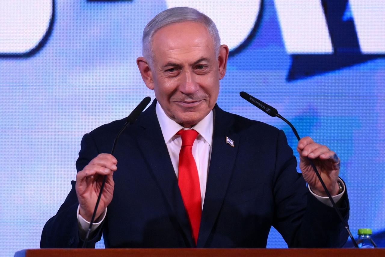 Israeli Prime Minister Benjamin Netanyahu prepares to greet supporters in Jerusalem after the first exit poll results were announced Tuesday (local time). [AFP]