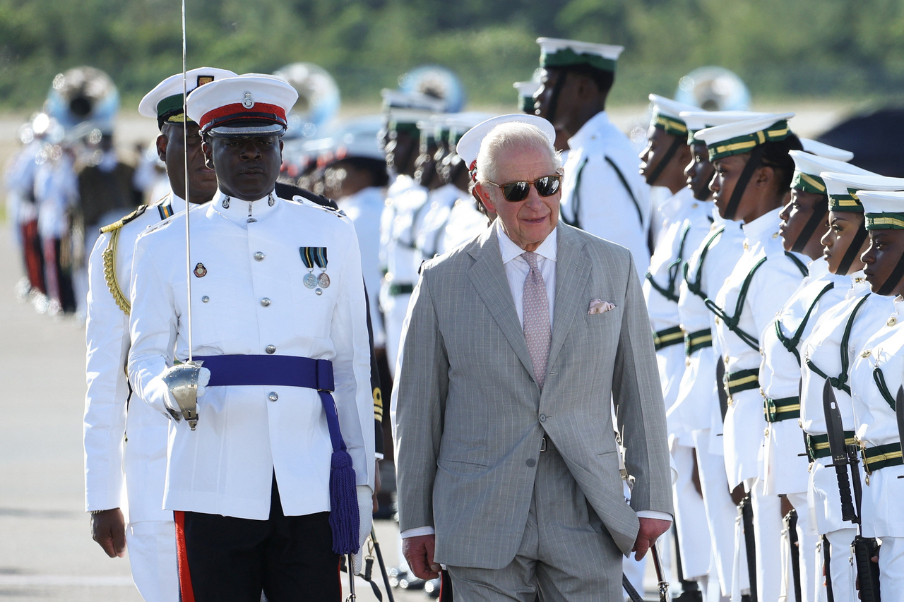 Britain's King Charles walks as an honour guard stands during his arrival at Lynden Pindling International Airport in Nassau, the Bahamas, Tuesday. (Reuters-Yonhap)
