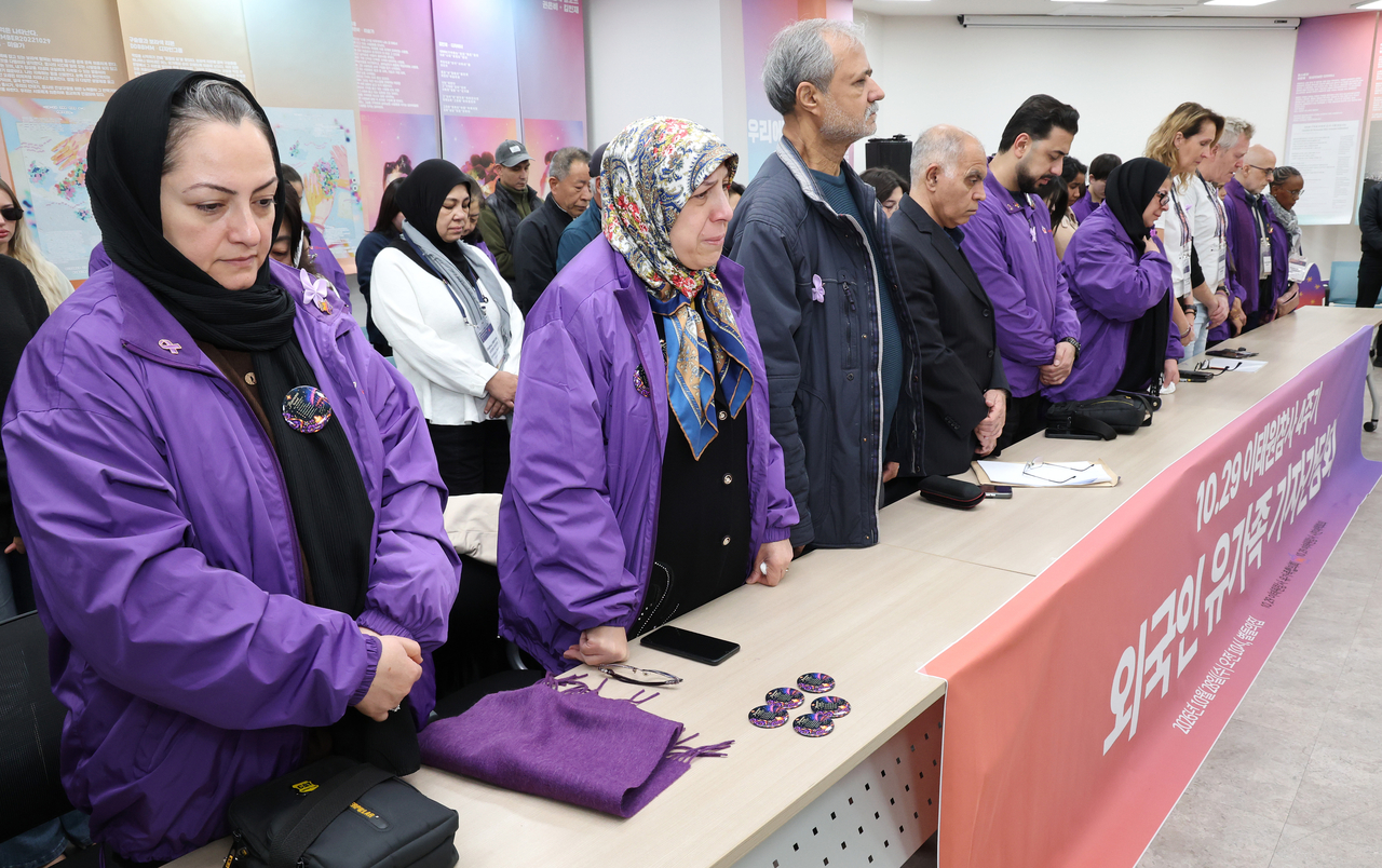 Bereaved families of foreign victims of the 2022 Itaewon crowd crush pay respect for the victims during a press conference at Stars’ Home in central Seoul on Wednesday. (Yonhap)