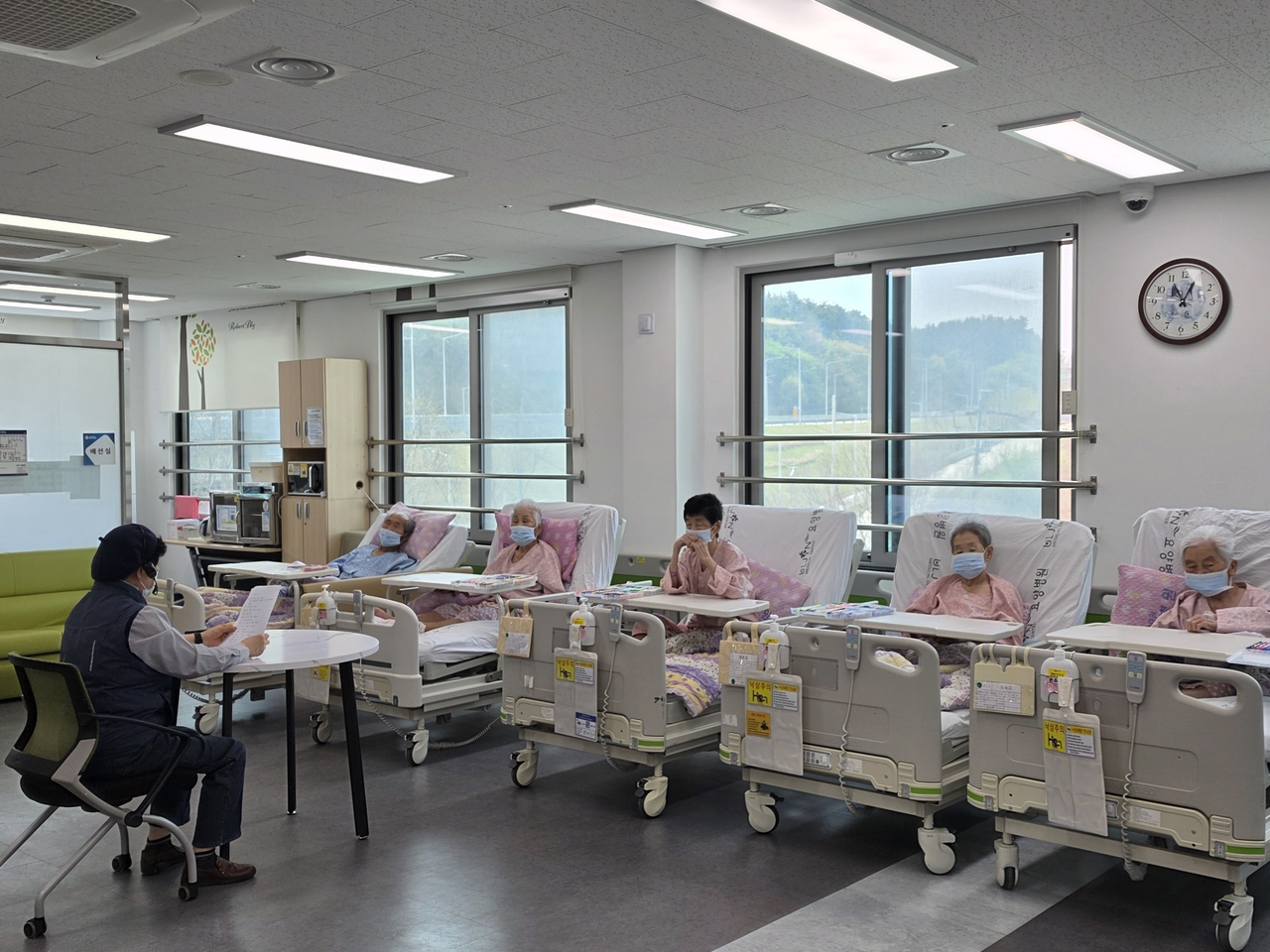 Elderly patients with dementia participate in a cognitive therapy program while lying in their beds at Uljin County Medical Center Nursing Hospital in Uljin, North Gyeongsang Province. (Uljin County)