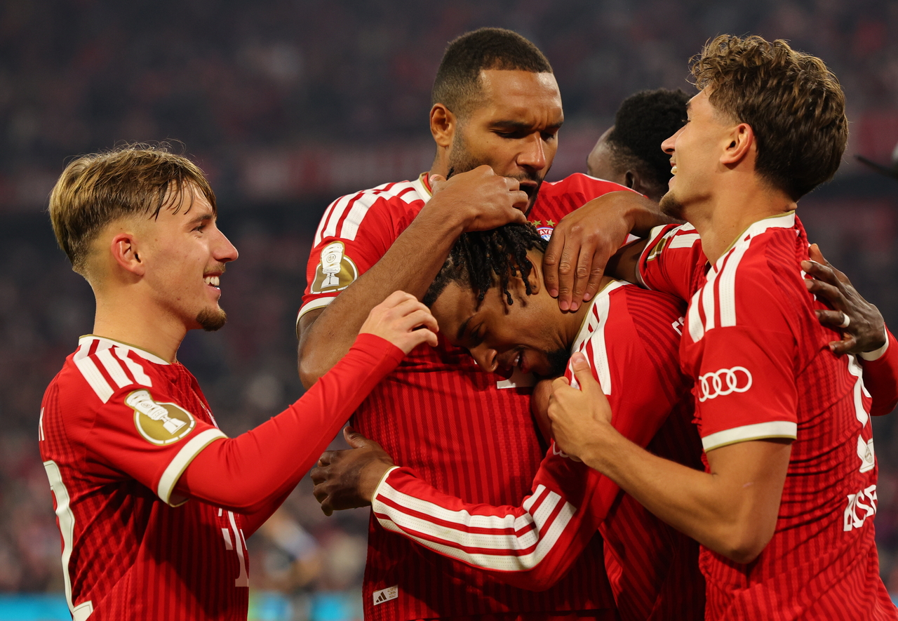 Bayern Munich players celebrate the team's third goal during a match against 1. FC Magdeburg, in Munich, Germany, Wednesday.   (EPA-Yonhap)