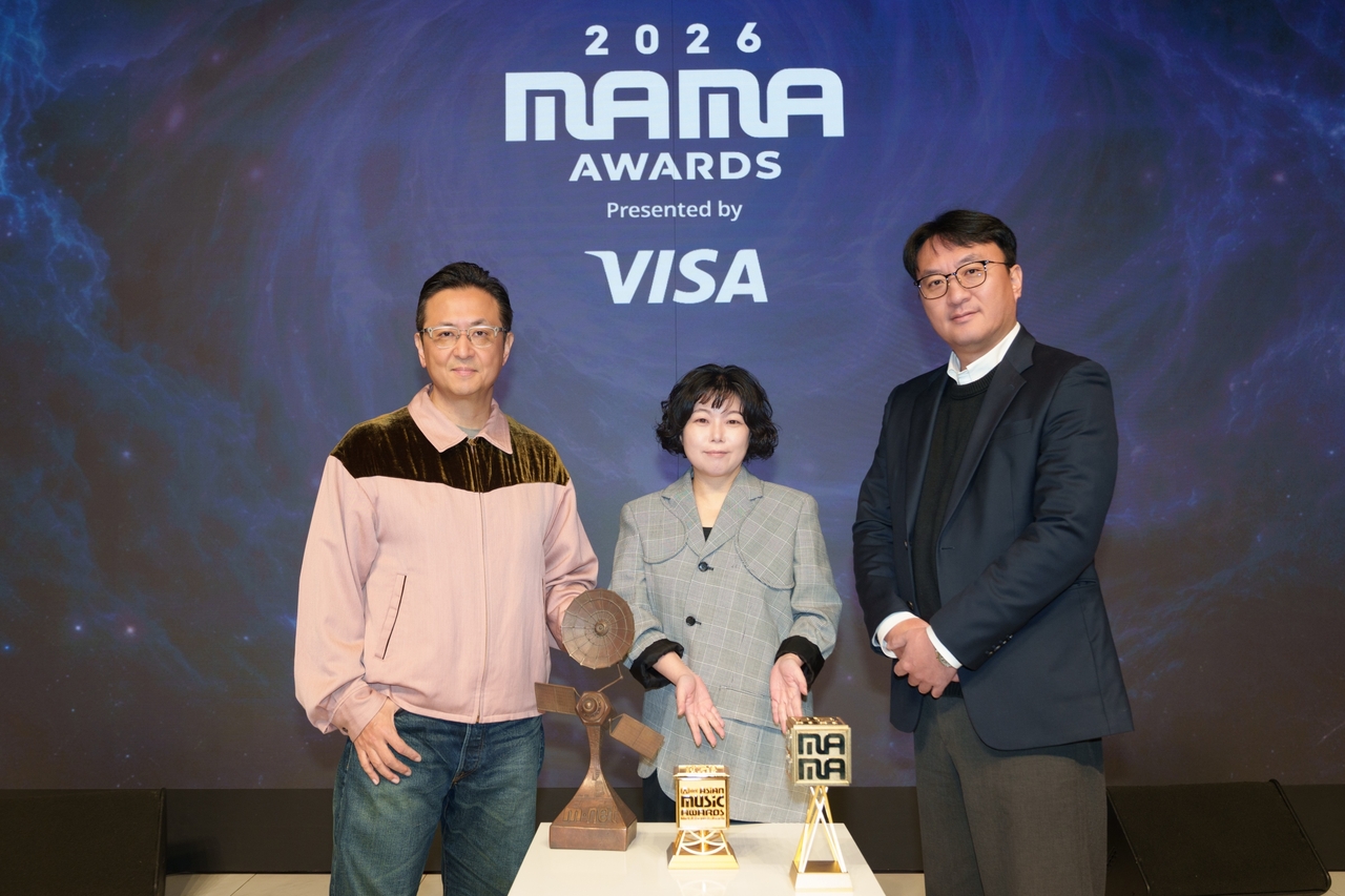 From left: Shin Hyung-kwan, head of music entertainment at CJ ENM; Yoon Shin-hye, head of Mnet; and Park Chan-uk, head of live entertainment business, pose for a picture during a press premiere of the 2026 MAMA Awards held at Eliena Hotel in Gangnam-gu, southern Seoul, Thursday. (CJ ENM)
