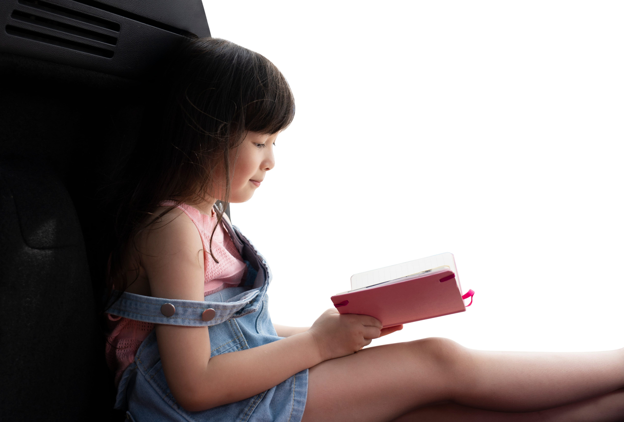 A stock photo of a child reading a book. (123rf)
