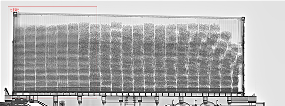 An X-ray scan by Gwangju Customs showing an anomalous shadow that led to the discovery of the counterfeit cigarettes.