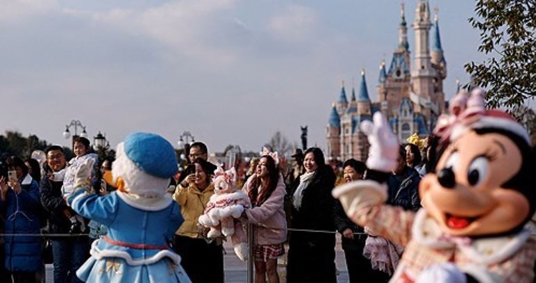 Visitors at a theme park. [Reuters]