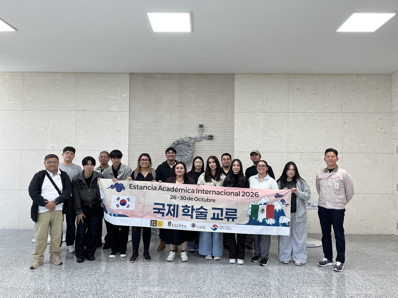 The Busan-Jinhae Free Economic Zone Authority conducts a "BJFEZ Insight Trip" with 14 participants, including students from Busan University of Foreign Studies and Mexico's Universidad Autónoma de Nuevo León, touring Samyoung MT Co. and key development zones on Friday. [Provided by BJFEZ Authority]