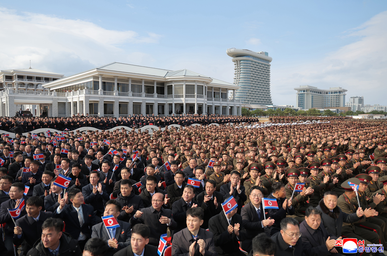 North Korean military personnel applaud at the “Unmanned Aviation Technology Development 2026” exhibition on Thursday in this photo released by the Korean Central News Agency on Friday. (Yonhap)