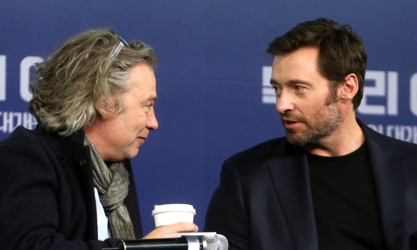 Director Dexter Fletcher (left) and actor Hugh Jackman speak during a press conference at the Four Seasons hotel in Seoul on Monday for their latest film, "Eddie the EAgle." (Yonhap)